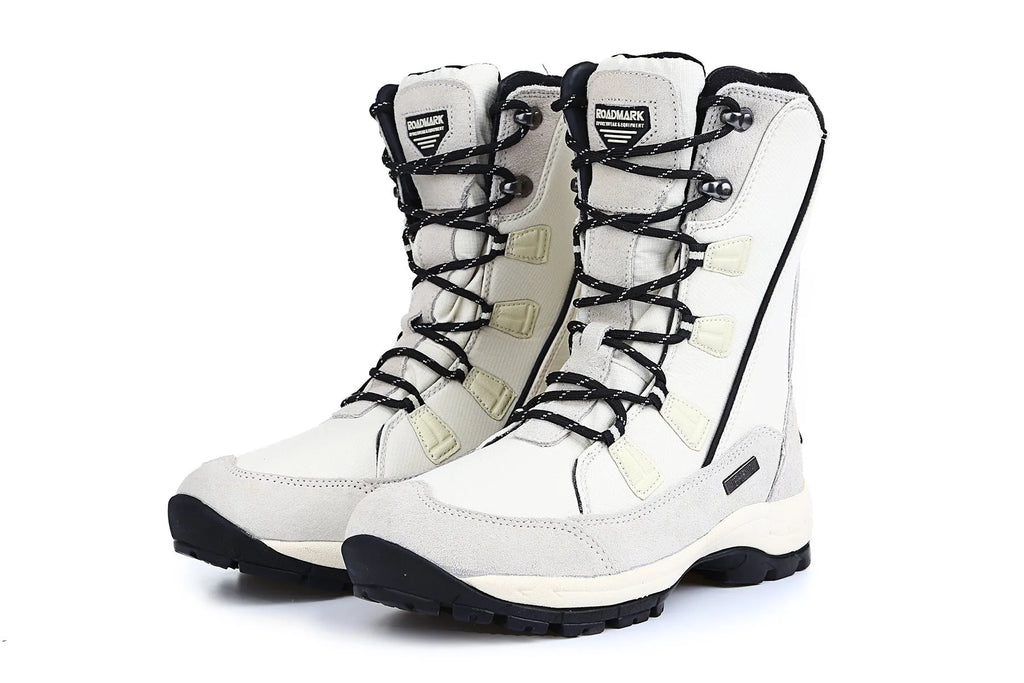 Women's black genuine leather mid-calf snow boots with round toe and thick rubber sole on a white background.