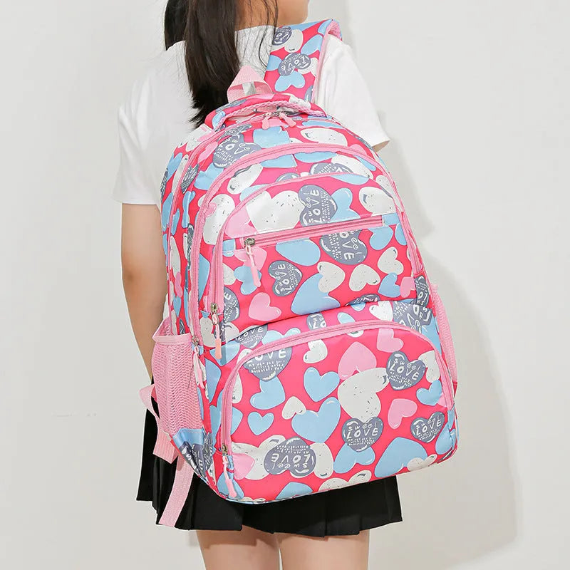 Student backpack with air pillow belt system in blue, rose red, grey, or pink colours
