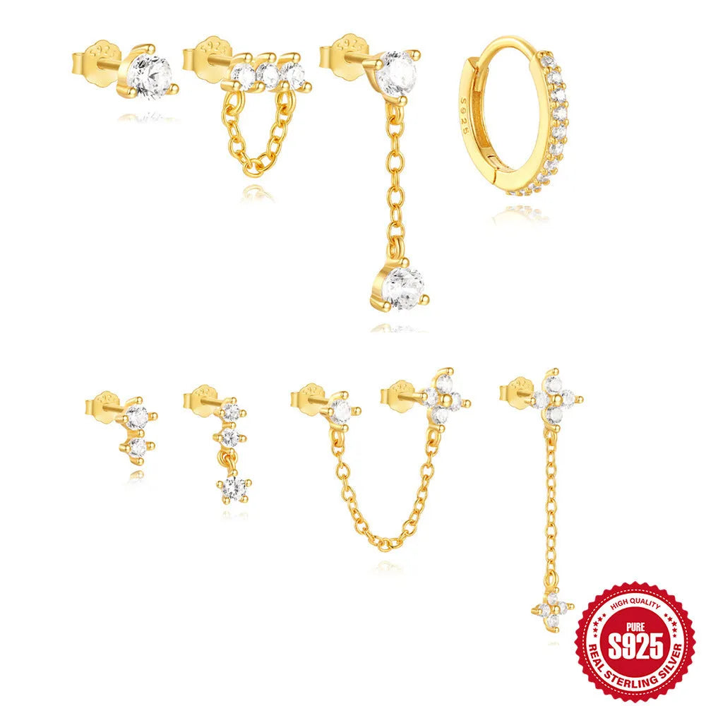 Close-up of geometric S925 sterling silver earrings with a gold electroplated clover petal design.