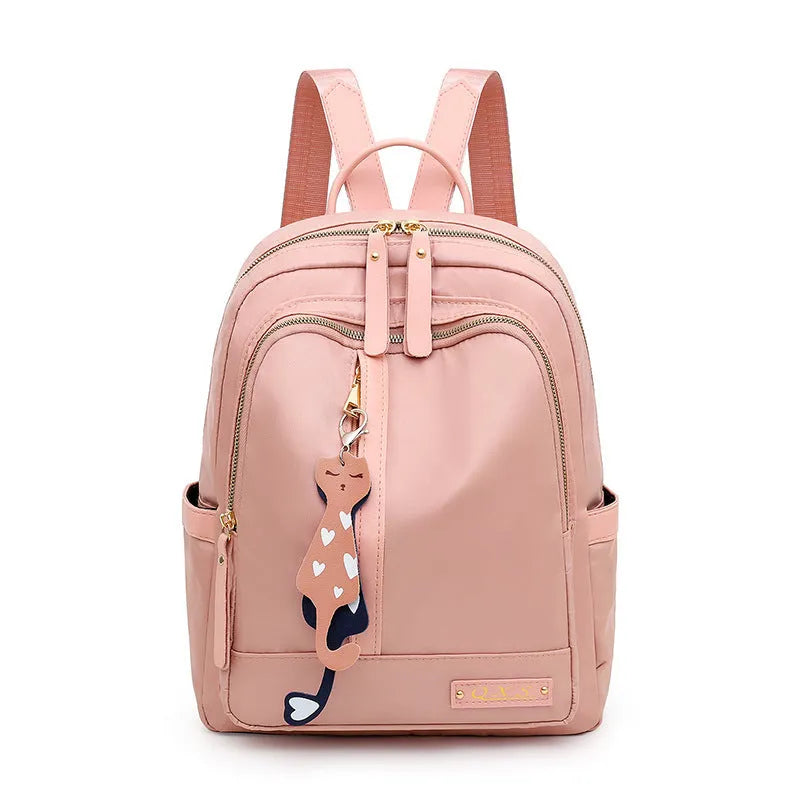Black and pink women's casual nylon backpack showing soft surface and shoulder straps