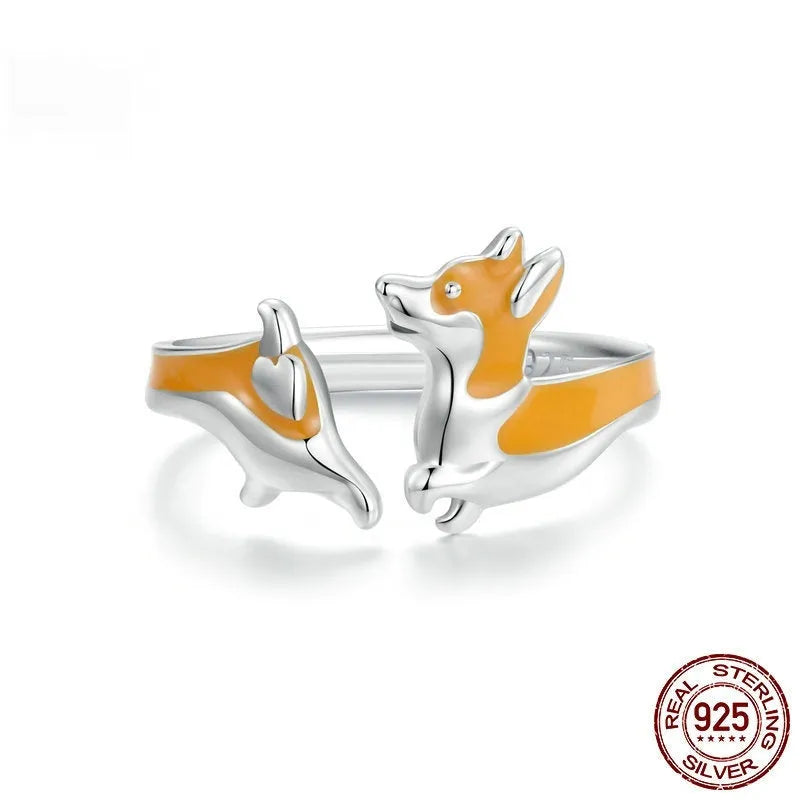 Silver ring with a raised cartoon corgi dog design, colour SCR1014-E.