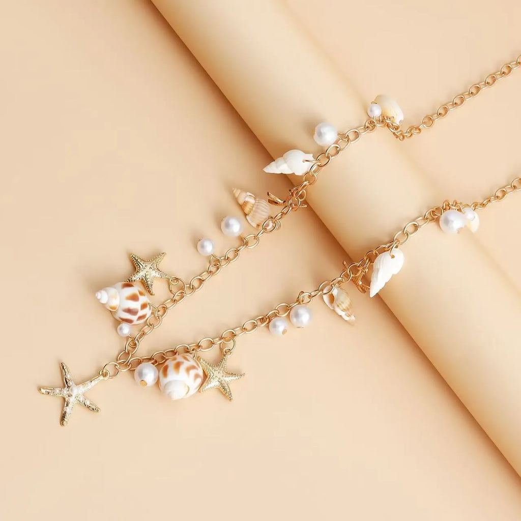 Women's alloy waist chain and matching bracelet with star shell design for summer fashion