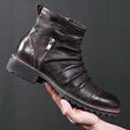 Men's black high-top cowboy boots with side zip and round toe on a plain background