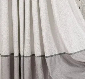 A single blackout curtain panel showing its polyurethane-backed fabric and one of the available hanging styles.