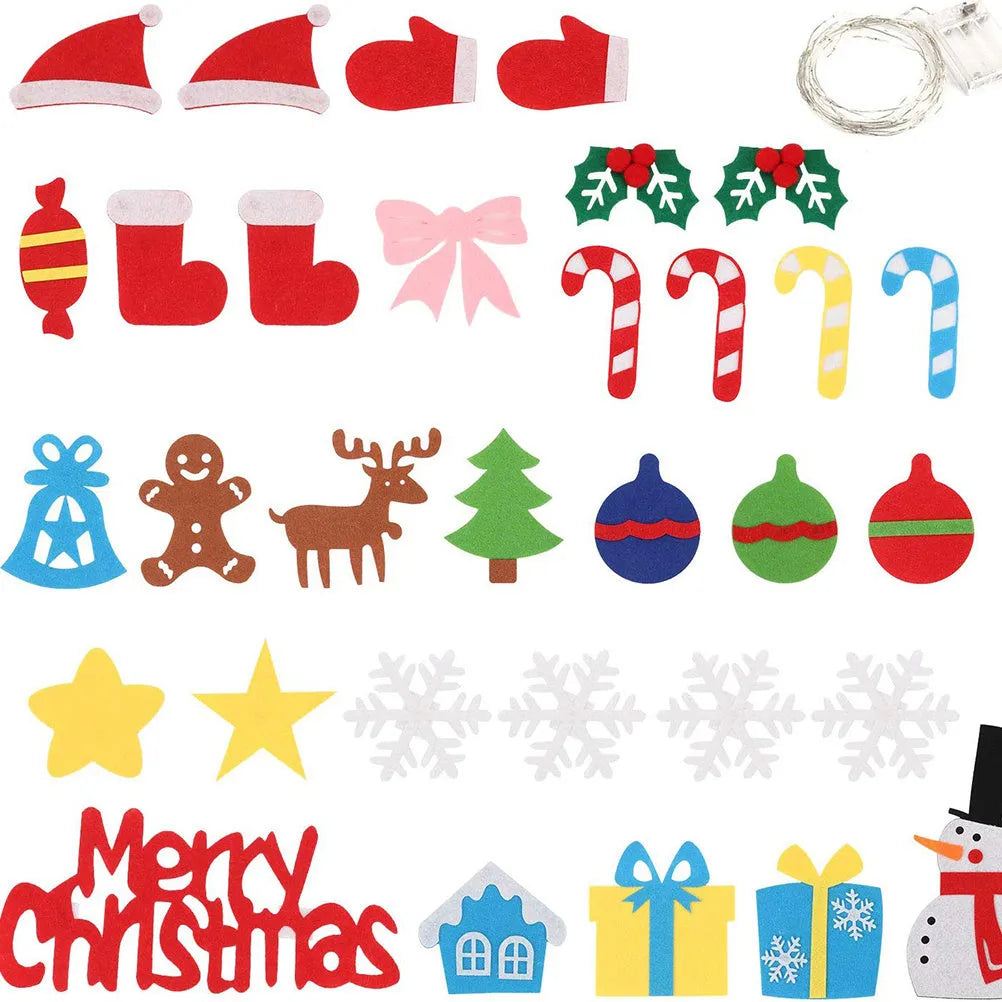 Green DIY felt Christmas tree with fairy lights and ornaments on a white wall with decorations attached