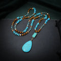 Blue turquoise necklace with large water drop pendant and imitation mineral gemstone detail
