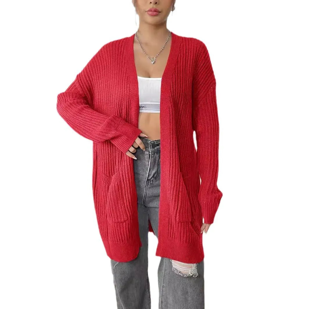 Dark green women's loose-fit acrylic cardigan with two pockets and long sleeves.