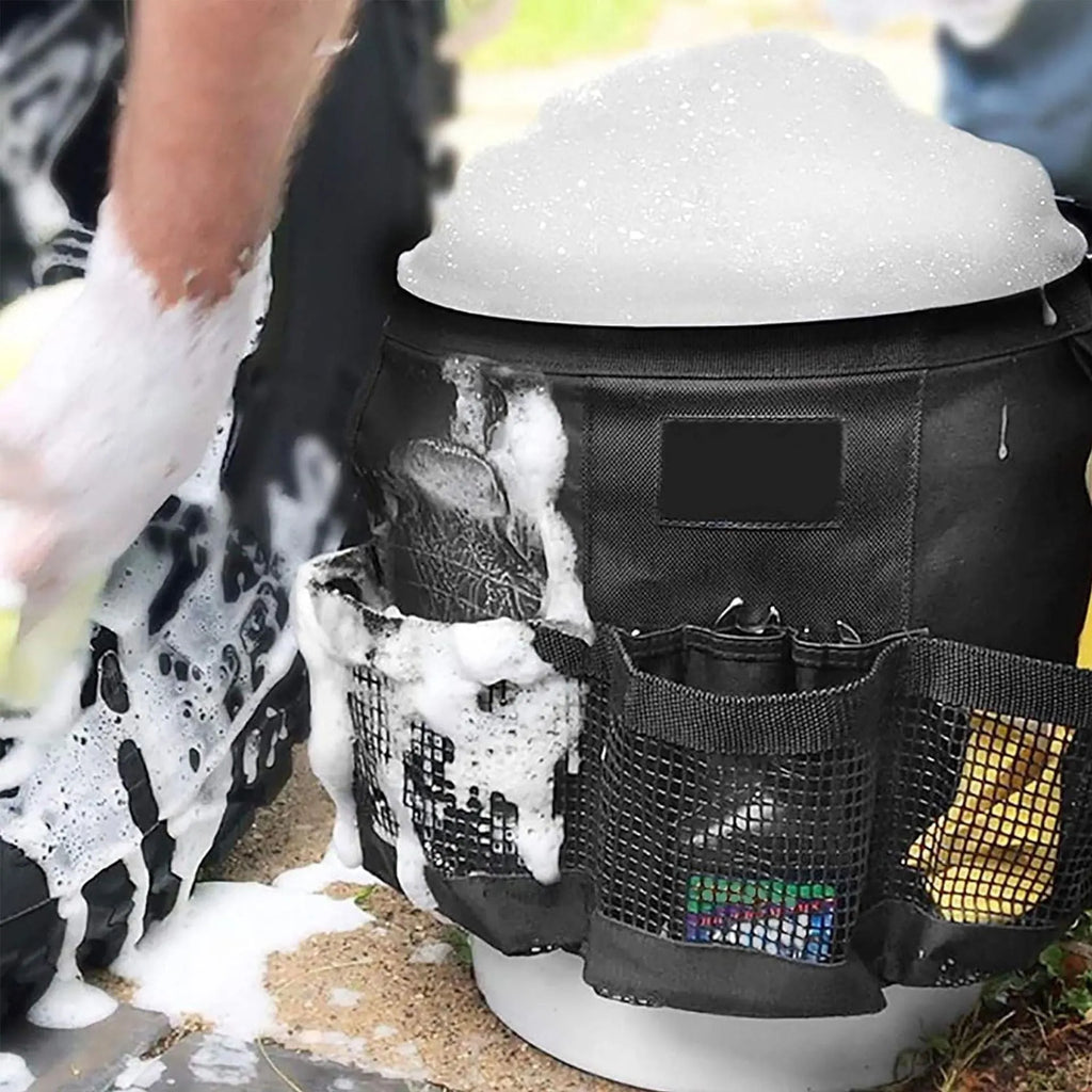 Black cylindrical polyester storage bag hanging on a 5-gallon bucket for organising tools.