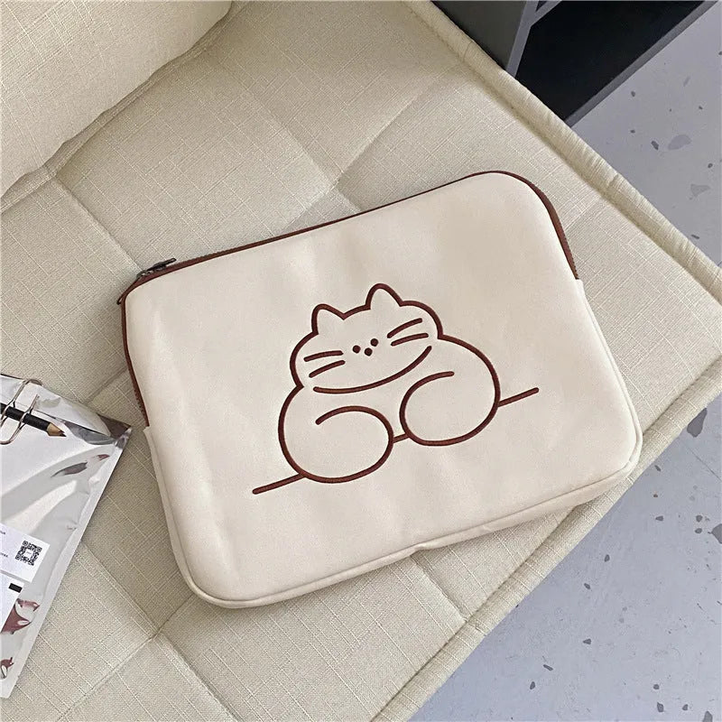Fat cat embroidered design on a grey protective laptop sleeve with a black zip.