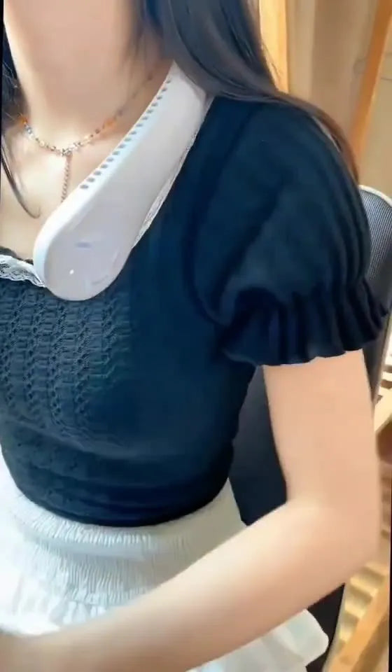 Pink USB rechargeable bladeless neck fan being worn, showing its adjustable speed controls and flexible neckband.