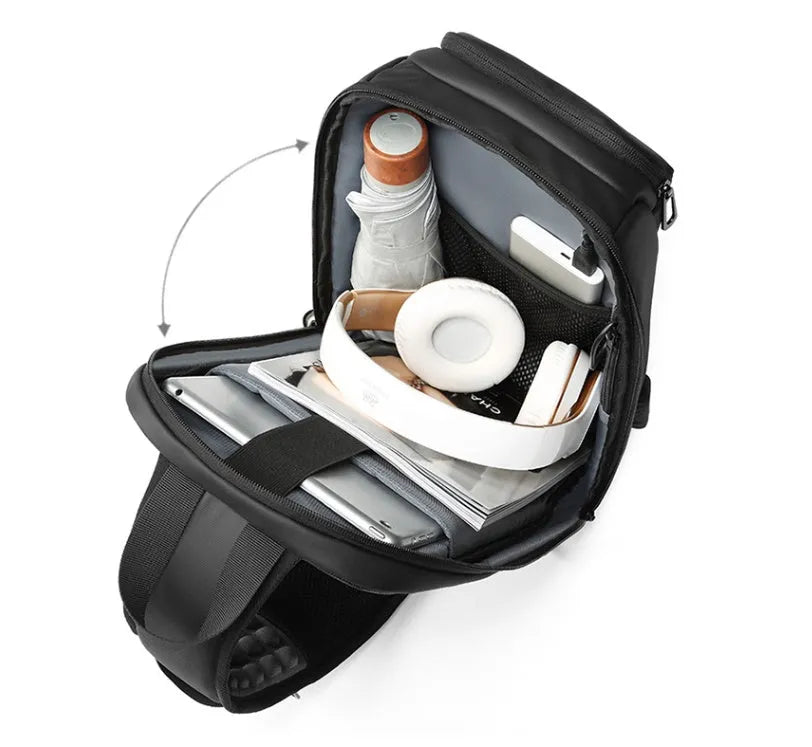 Black medium outdoor shoulder bag with air cushion strap showing internal laptop and organiser pockets