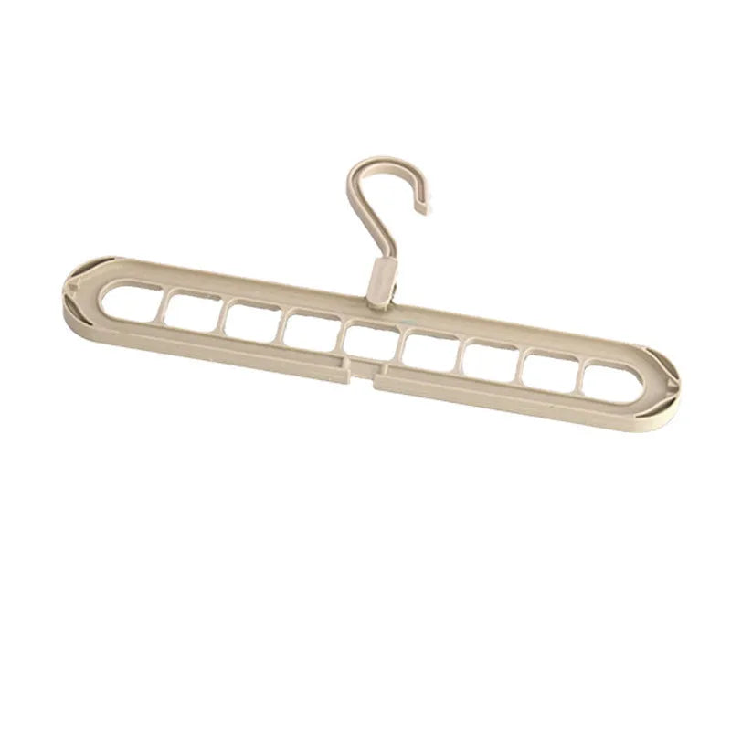 Plastic multifunctional hanger with nine holes for folding trousers in beige colour