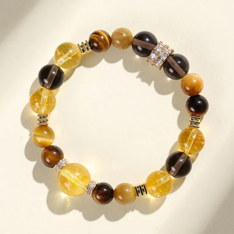 Natural yellow artificial crystal string beads bracelet, 10mm size, on a white background.