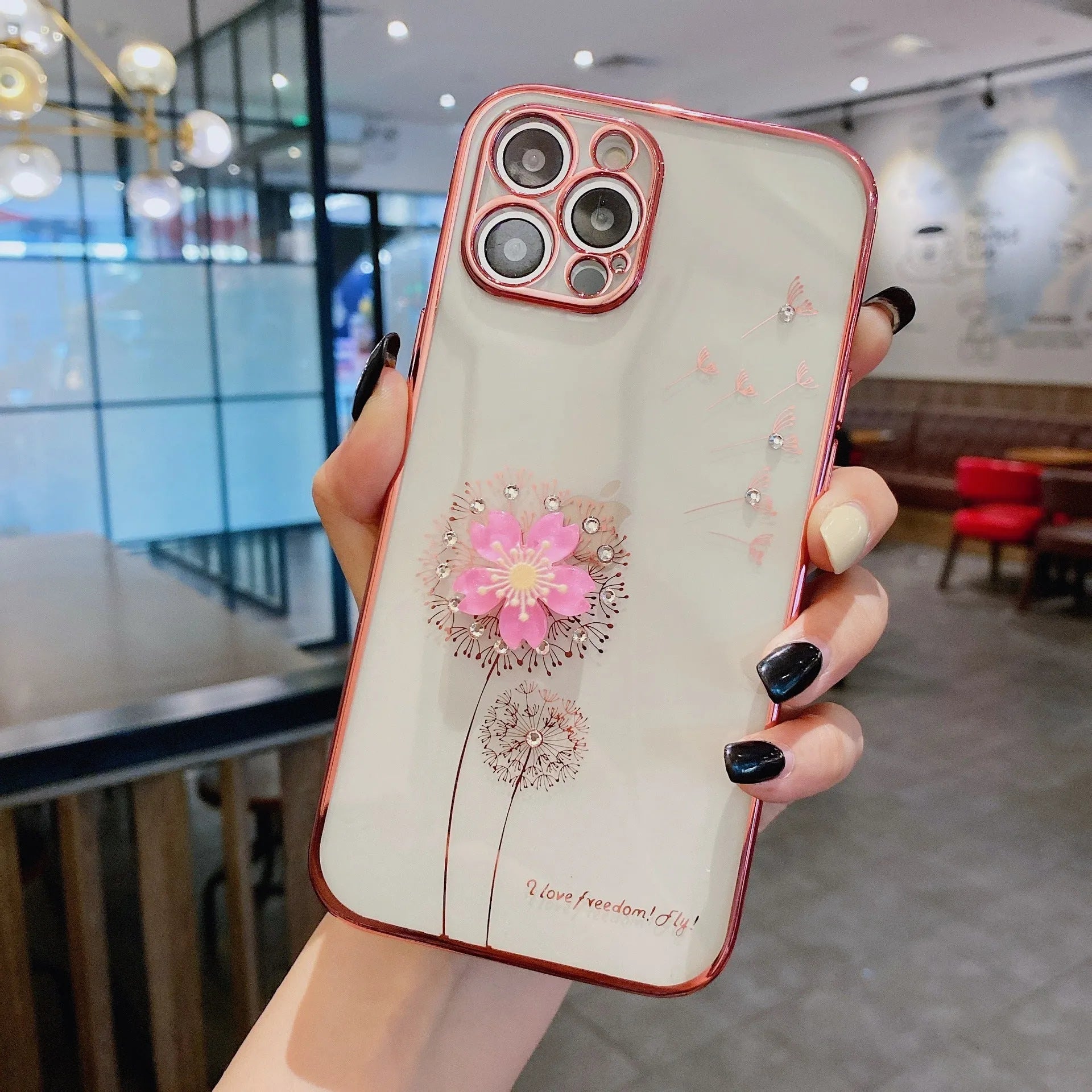 Green iPhone case with a 3D white flower design and a rotating stand on the back.