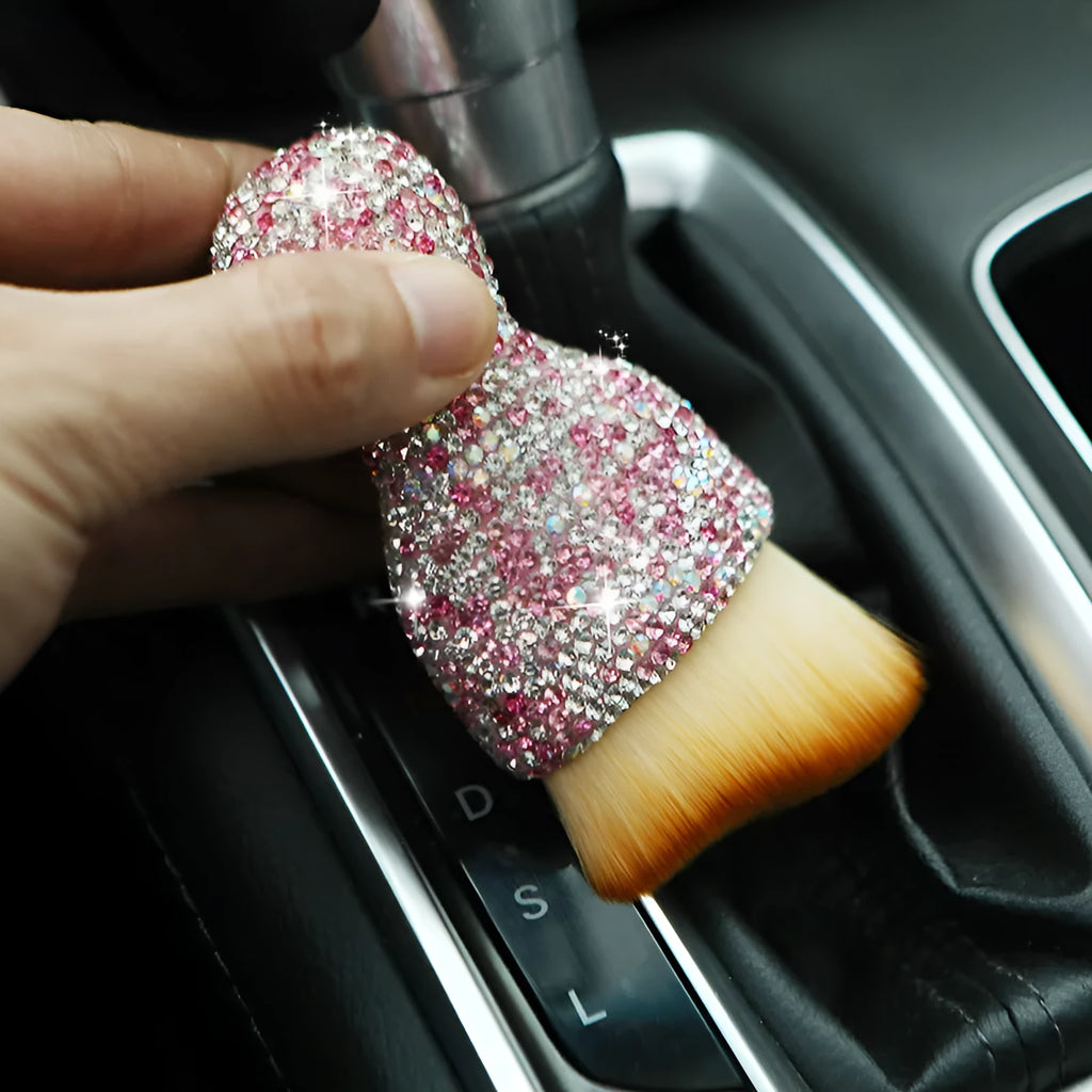 Compact white PVC soft-bristle brush for cleaning car dashboard vents and interior dust.