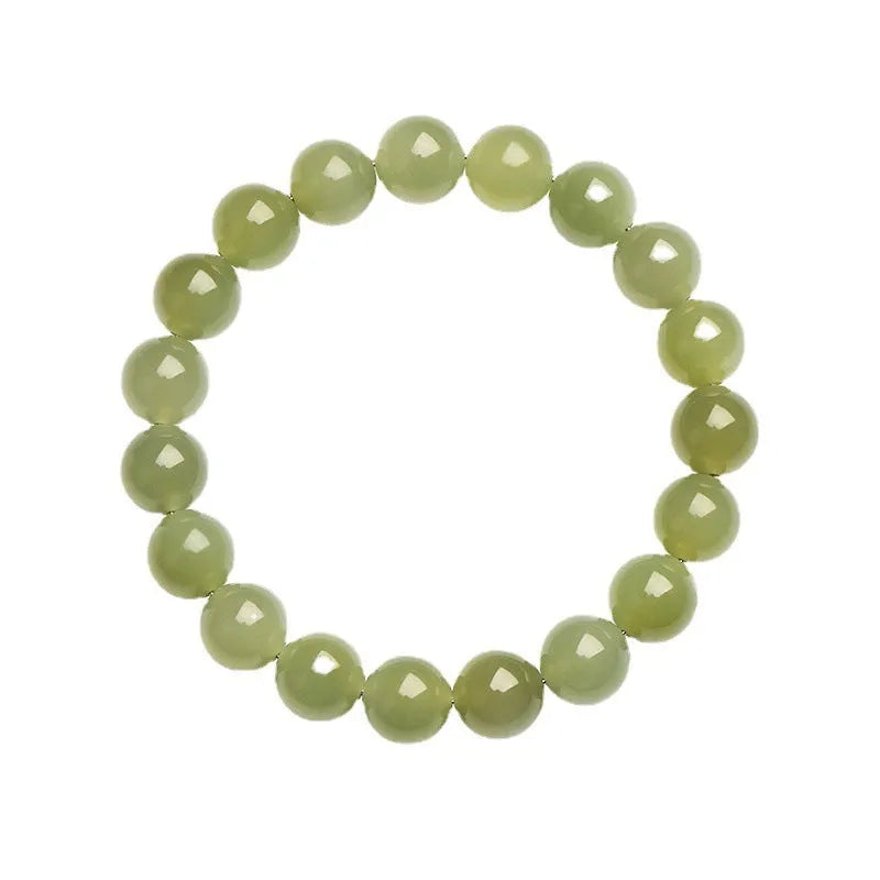 A polished Hetian jade ball bracelet showing beads in a clear ice-like colour on a wrist.