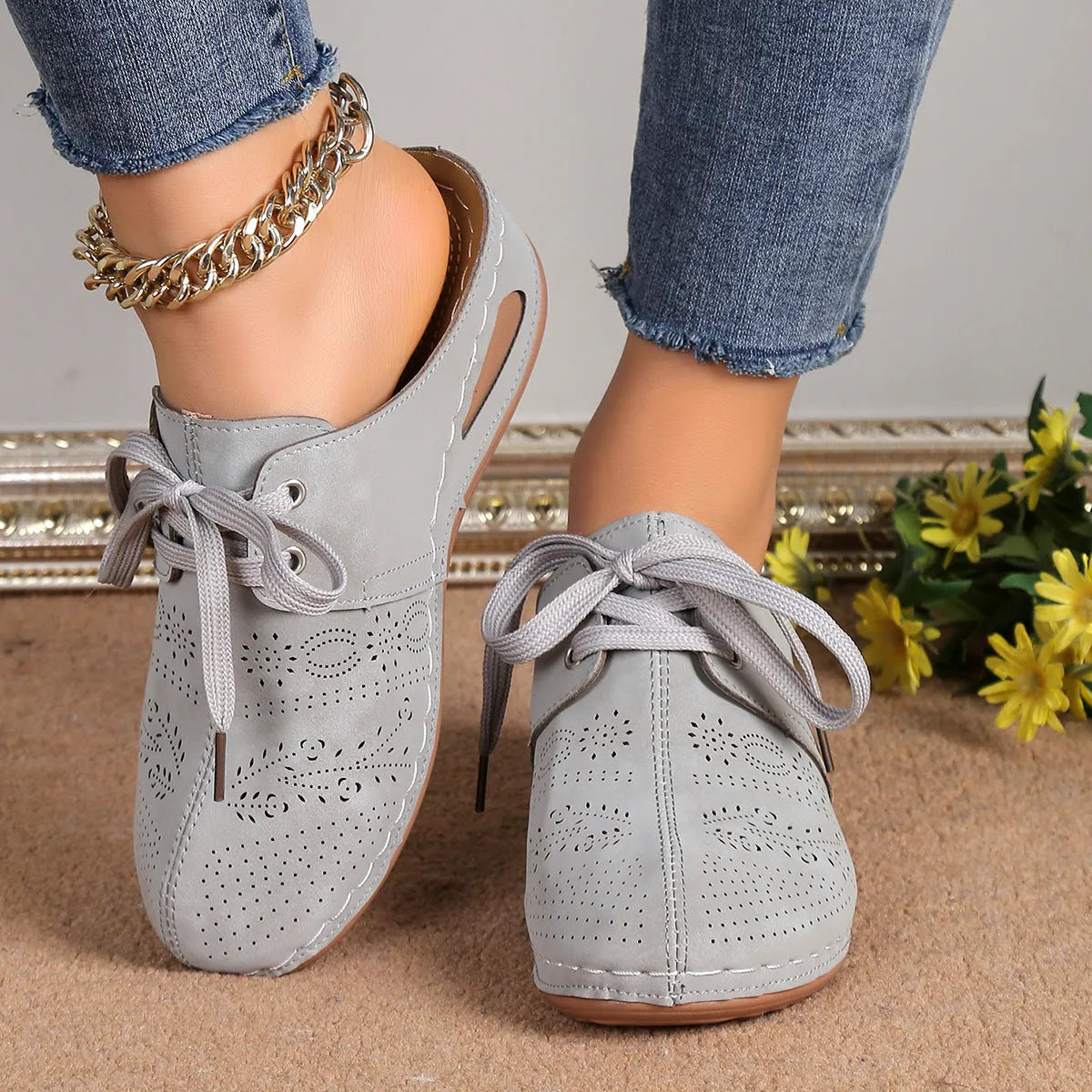 Women's black baotou lace-up slippers with hollow out wedge and suede upper on a rubber sole