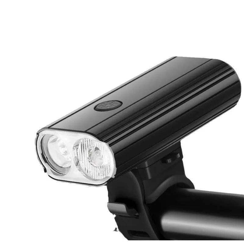 Aluminium alloy bicycle headlight with USB Type-C charging port, shown with quick-release handlebar mount.