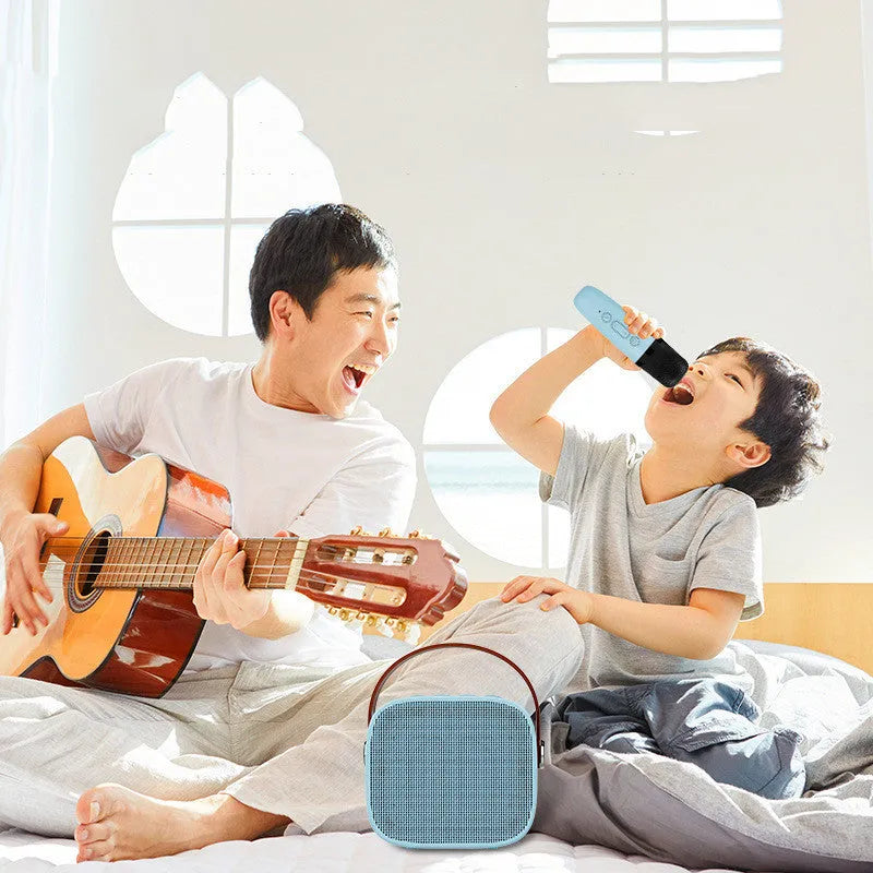 Portable Bluetooth speaker with microphone in white, pink or blue colours showing compact 8x6.5x7cm size