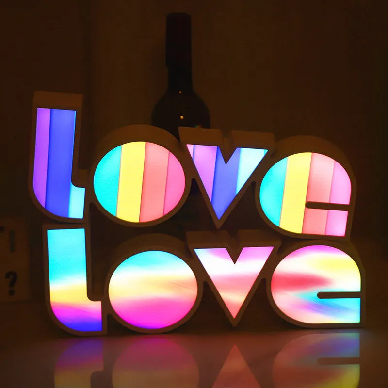 Rainbow halo style LED LOVE decorative light measuring 35.5cm wide