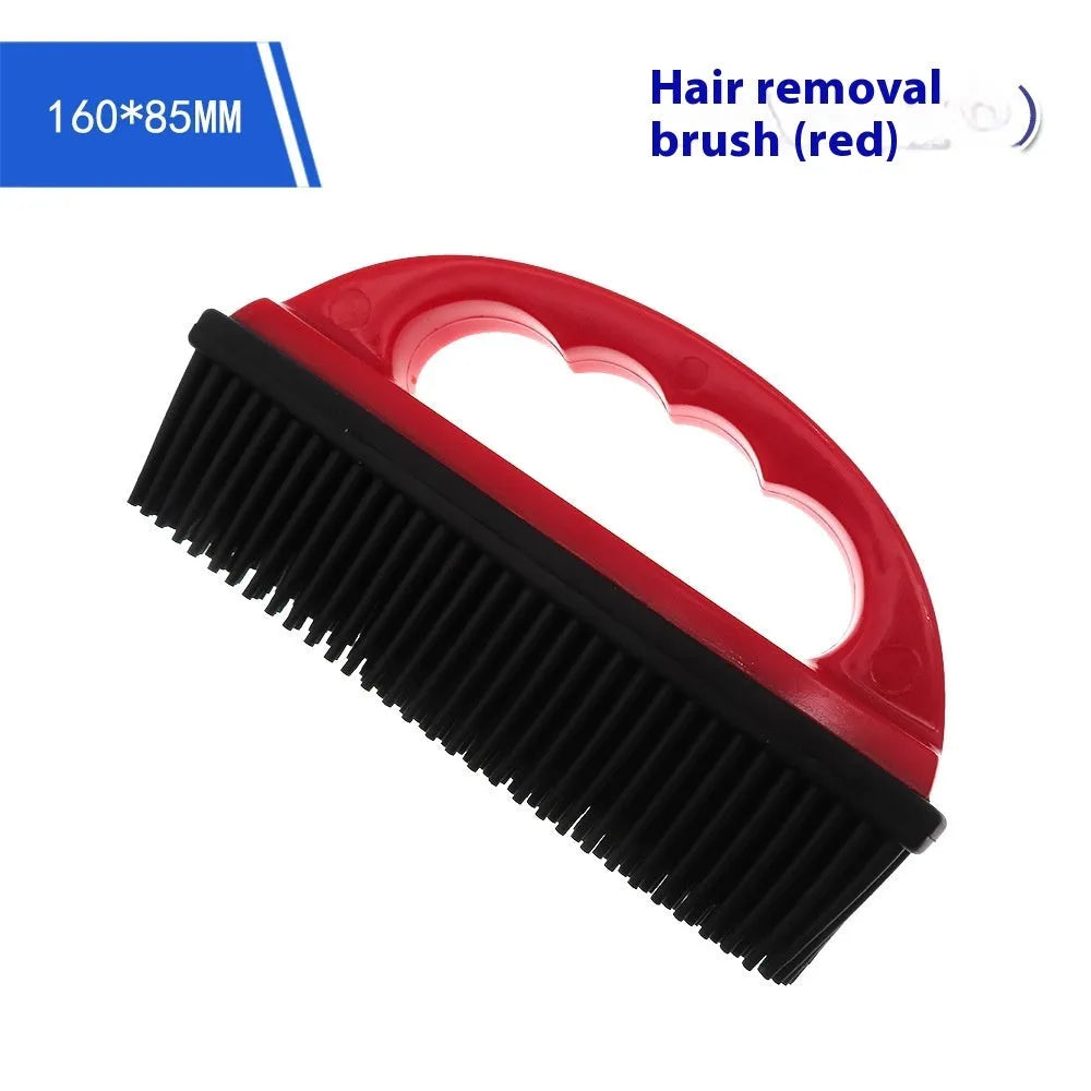 Red silicone pet hair removal brush with oval head measuring 160mm by 85mm.