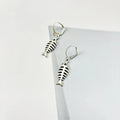 Women's vintage fishbone pendant necklace and matching earrings set with adjustable chain.