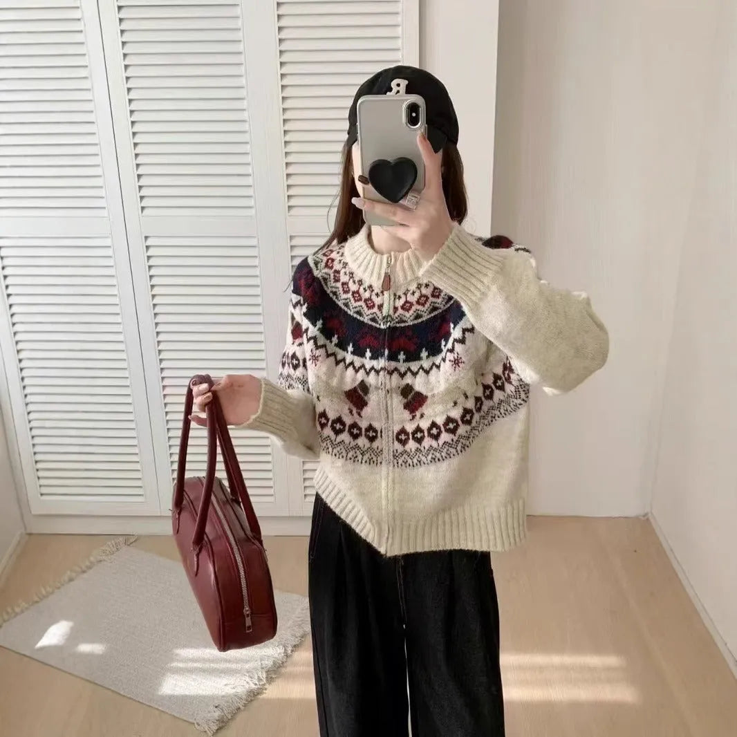 Beige apricot ethnic style jacquard pullover sweater with 3D pattern, round neck, and long sleeves laid flat.