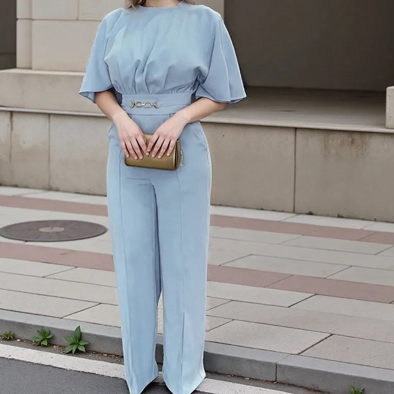 Blue two-piece polyester men's suit with long-sleeve jacket and trousers on a hanger.