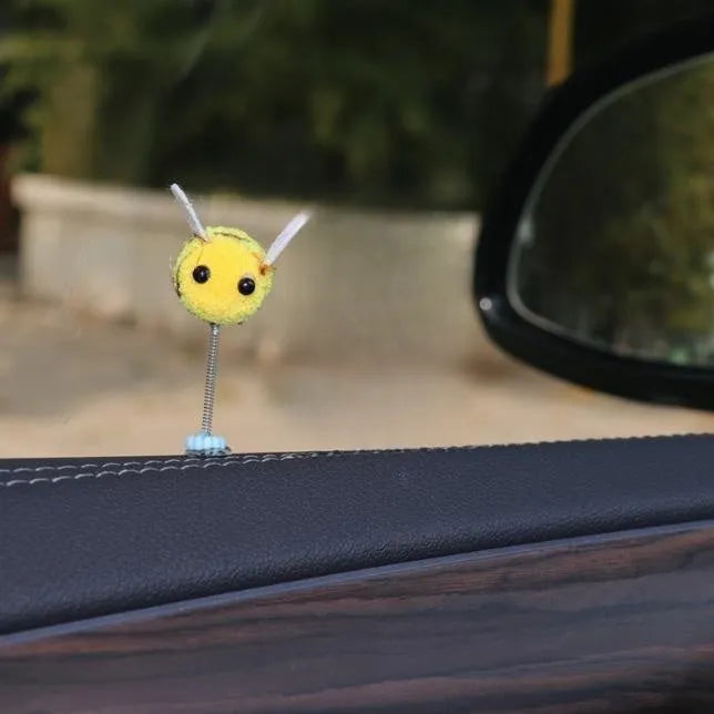 Cartoon bee car decoration with furry texture and swing spring on car dashboard