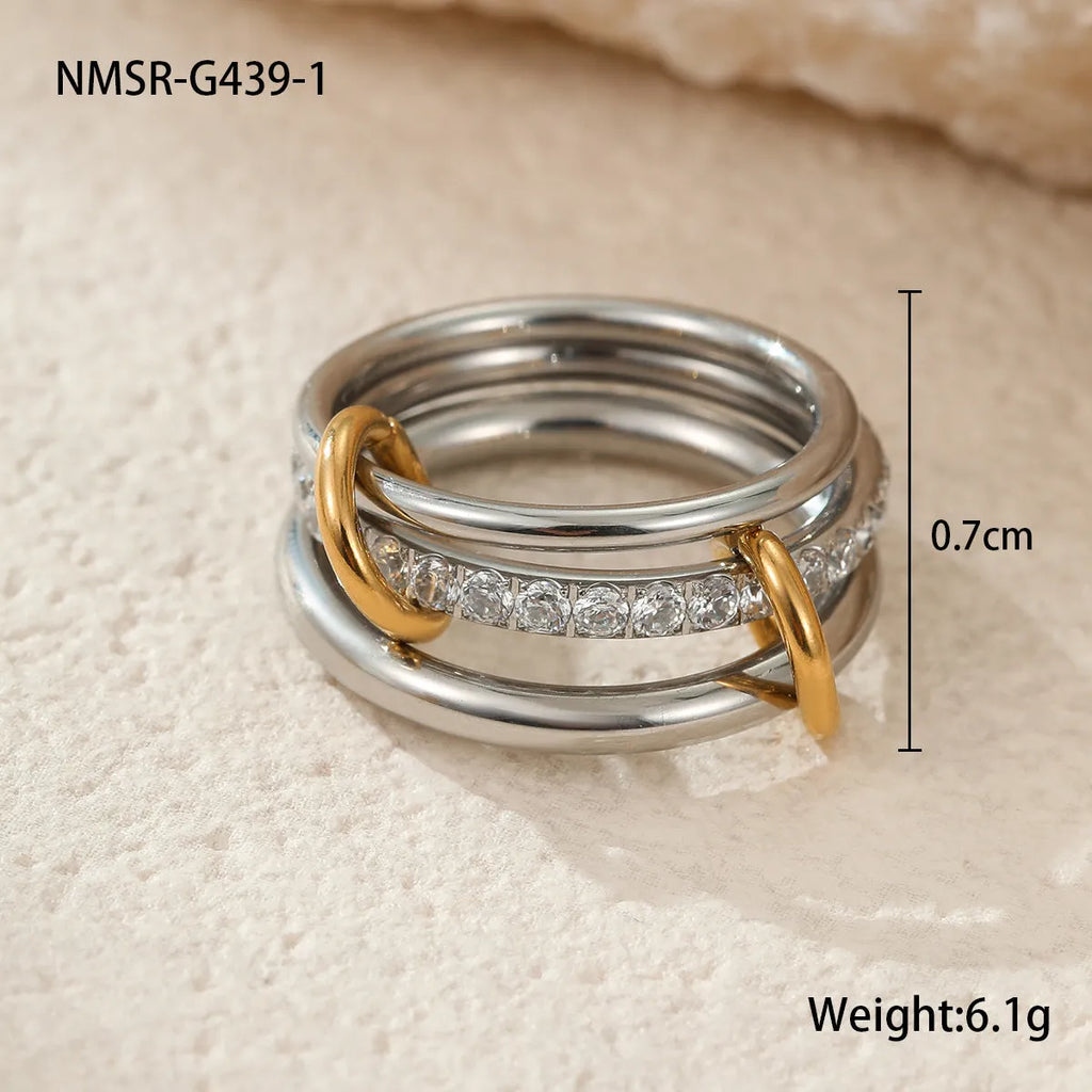 Three gold-plated geometric stacking rings with adjustable free size on hand