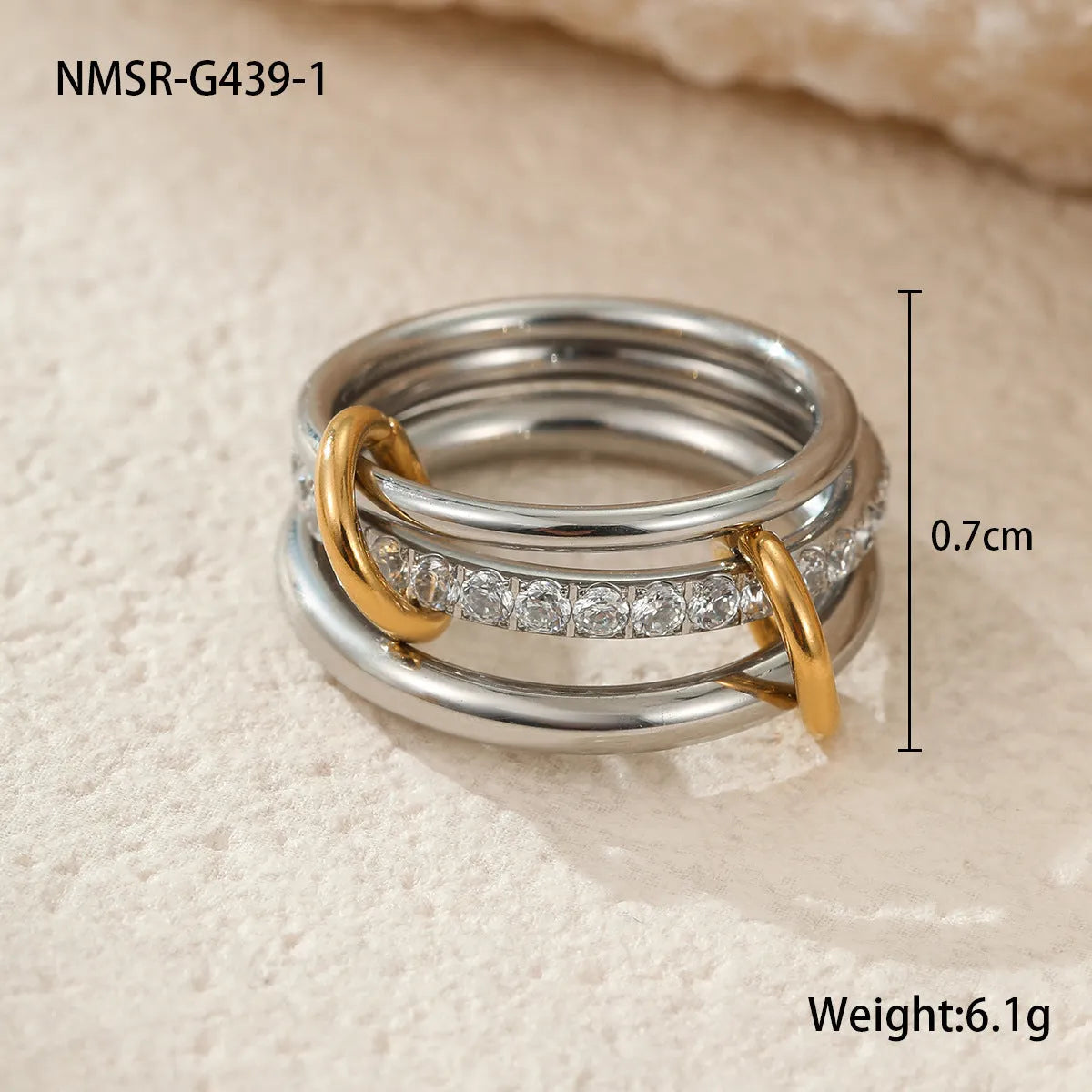 Three gold-plated geometric stacking rings with adjustable free size on hand