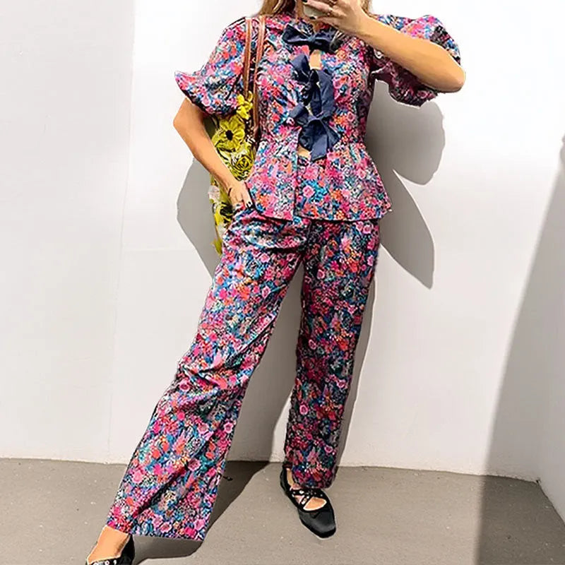 Women's floral printed polyester trousers suit with puff sleeves and tie-neck detail