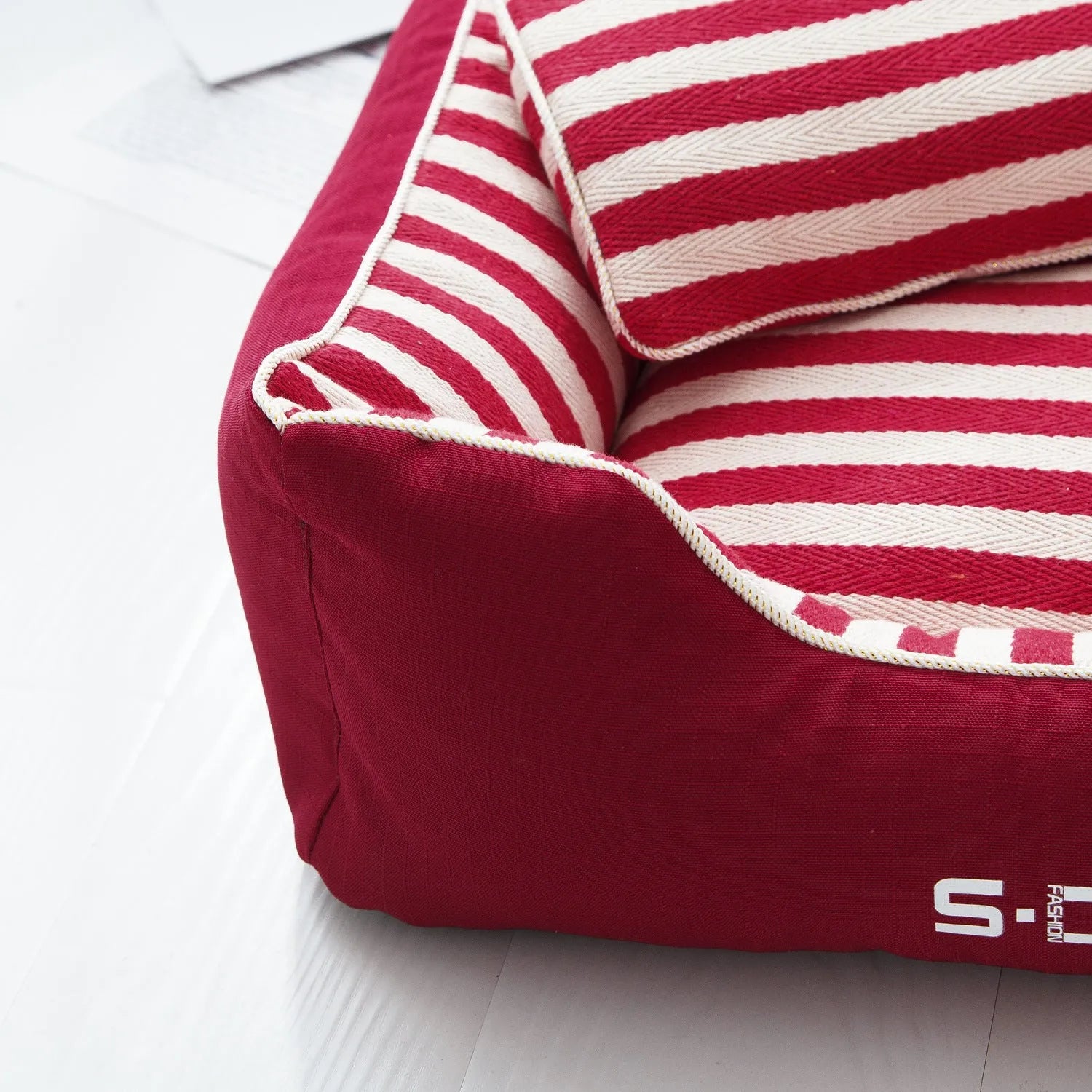 Navy stripes dog kennel mat and fabric pillow set in blue or red, shown in multiple sizes