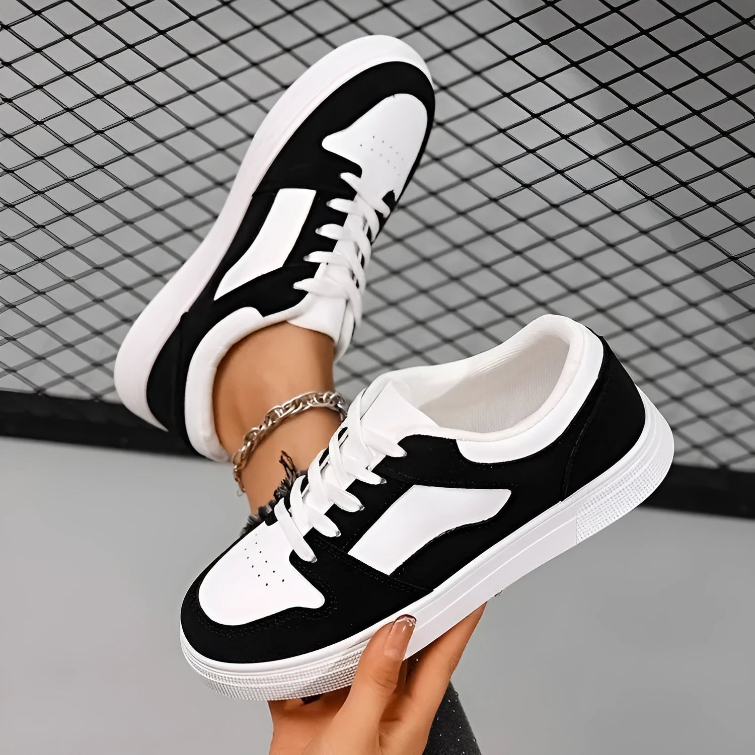 Black women's low-top casual sports shoes with a rubber sole and round toe.