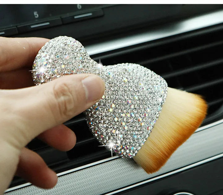 Compact white PVC soft-bristle brush for cleaning car dashboard vents and interior dust.