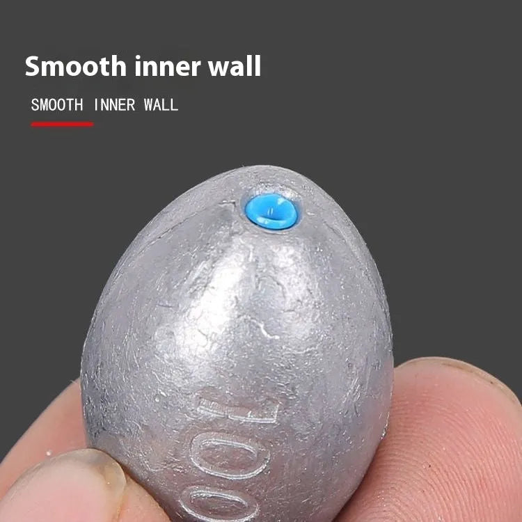 Tongxin olive lead fishing sinker with scale markings, showing rugby shape and plastic core.