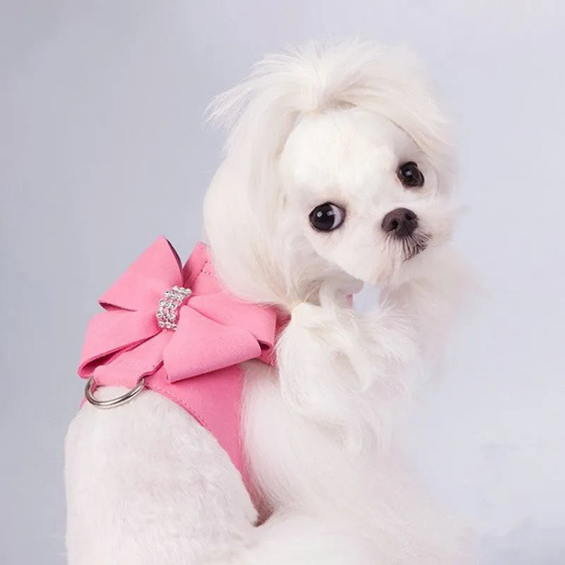A pink microfiber puppy chest strap with a bowknot, shown alongside blue and orange options.