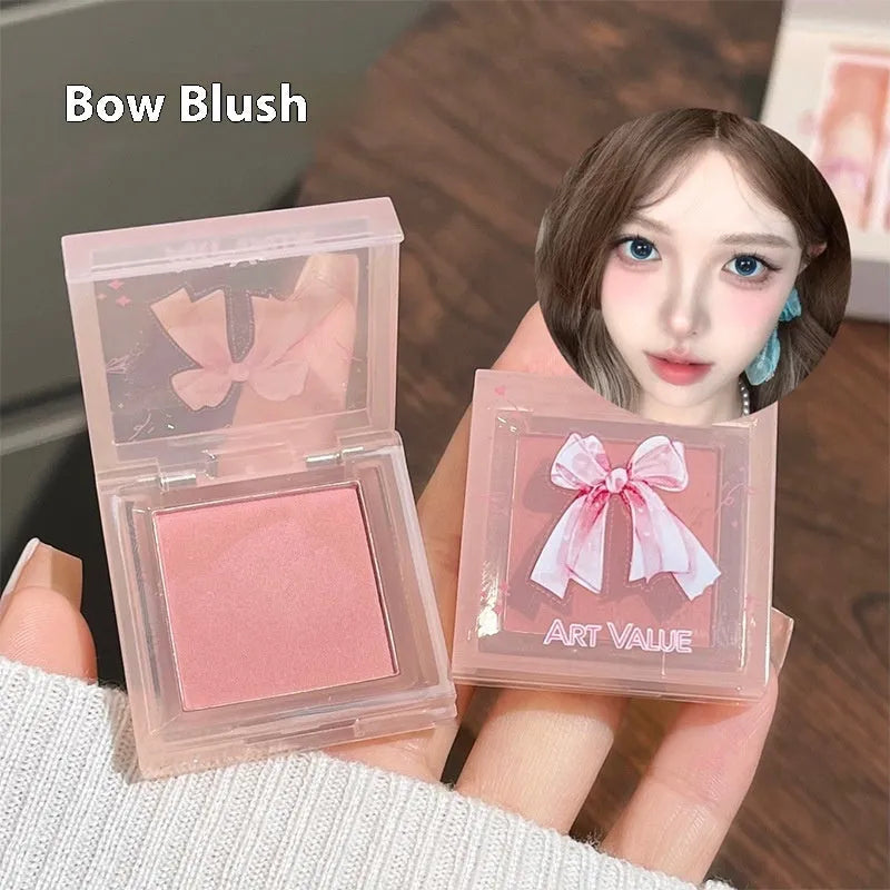 Pink Butterfly Box makeup set with four lip muds, a powder blusher, and a necklace