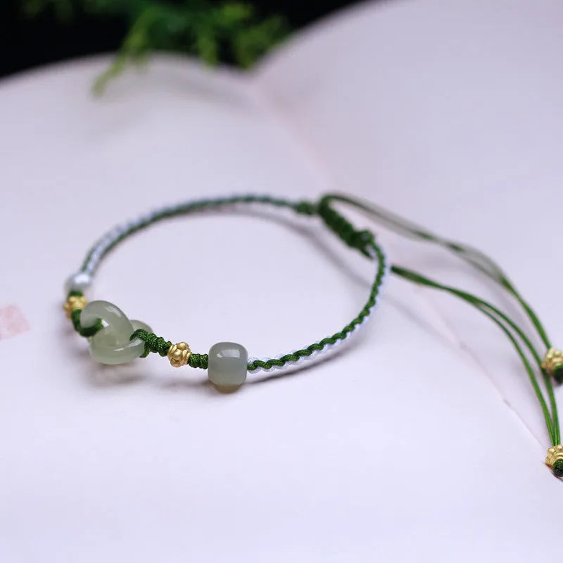 Hetian jade woven bracelet with flexible wire and hollow-out metallic elements