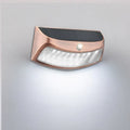Solar outdoor wall lamp with smiling face design for garden decorative lighting