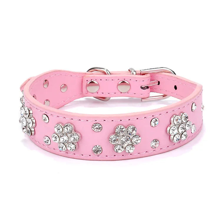 Black PU leather dog collar with sparkling rhinestone flower pattern and metal studs, showing adjustable eyelets and D-ring.