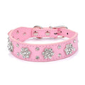 Black PU leather dog collar with sparkling rhinestone flower pattern and metal studs, showing adjustable eyelets and D-ring.