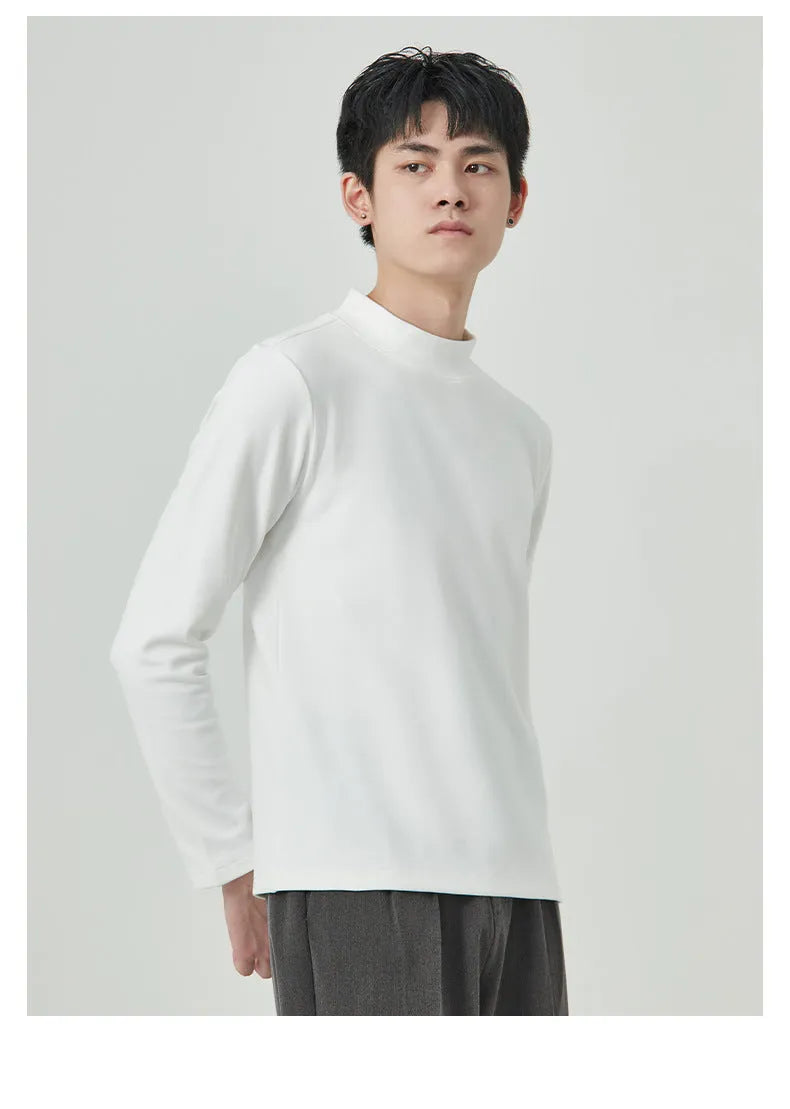 Man wearing a beige Dralon long sleeve T-shirt with a half-high collar, casual autumn outfit.