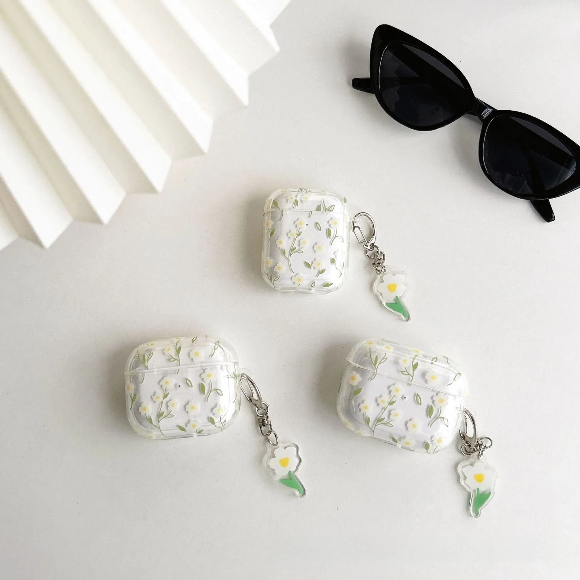 Transparent white floral TPU protective case for Apple AirPods showing decorative pattern