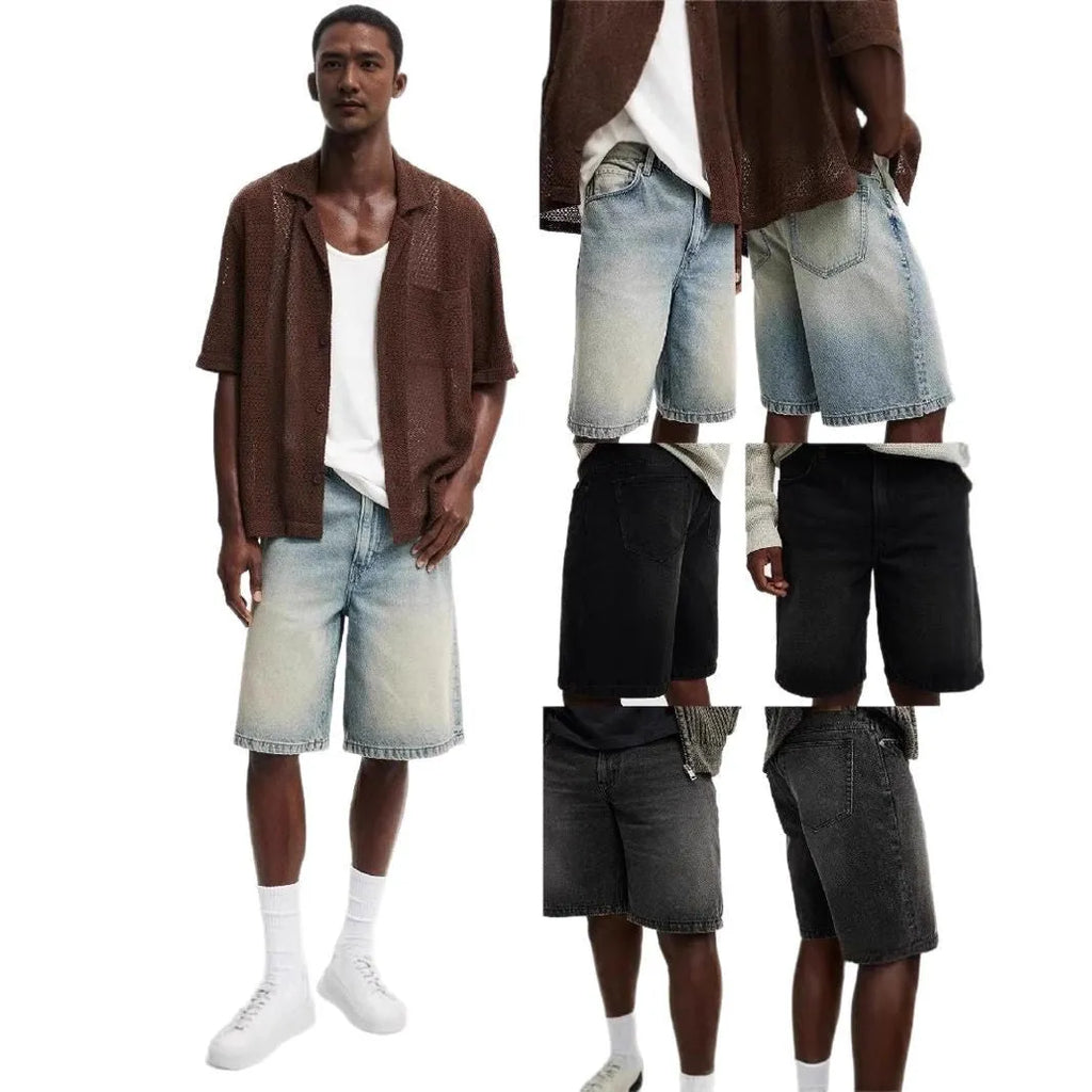 Man wearing loose light blue straight leg cotton jeans on a casual street.