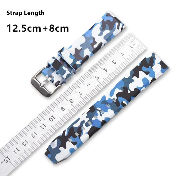 Green camouflage silicone watch strap shown detached, displaying its 20mm width and flat head lug design.