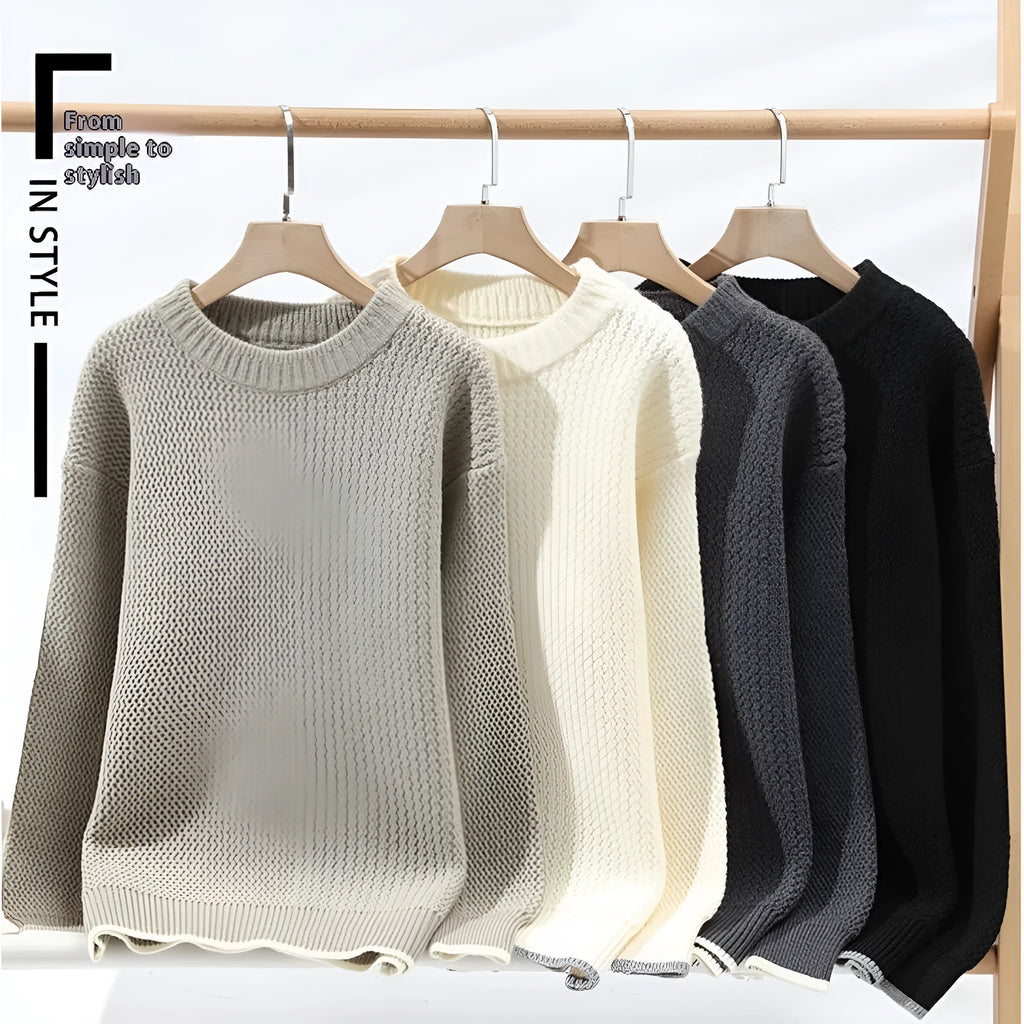 Grey loose fit men's round neck pullover sweater with long sleeves on a hanger.