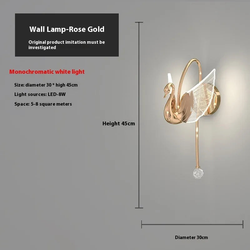 Gold modern swan-shaped wall lamp with an acrylic shade and dimmable LED light.