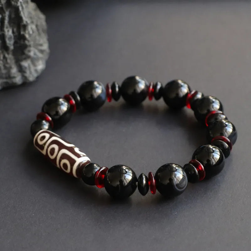 Black agate dzi bead bracelet with 11mm round beads in hand-woven geometry pattern