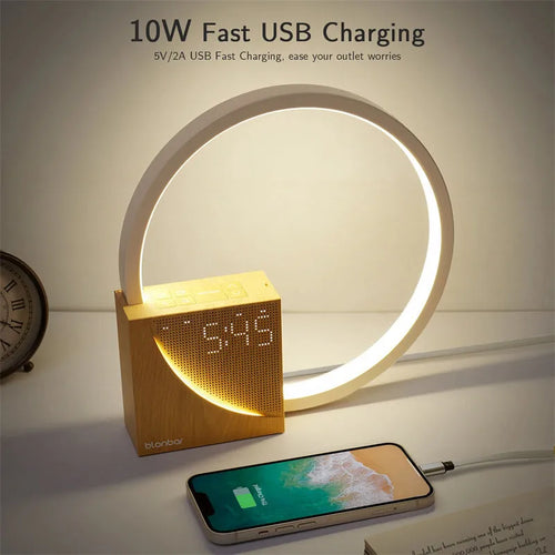 Navy blue touch control bedside lamp with digital alarm clock display on wooden table